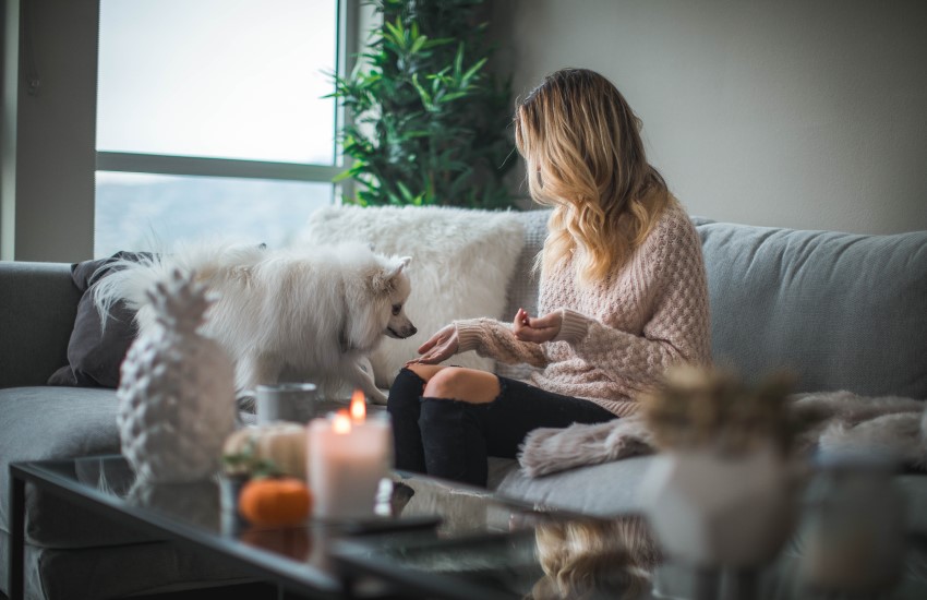 woman on couch with dog