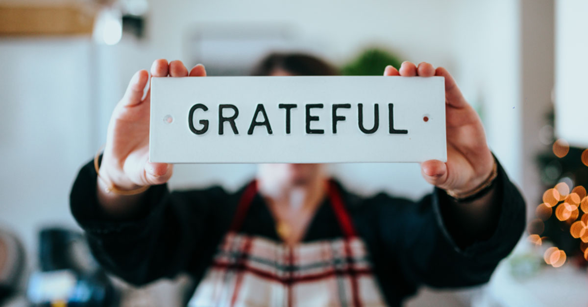 person holding grateful sign