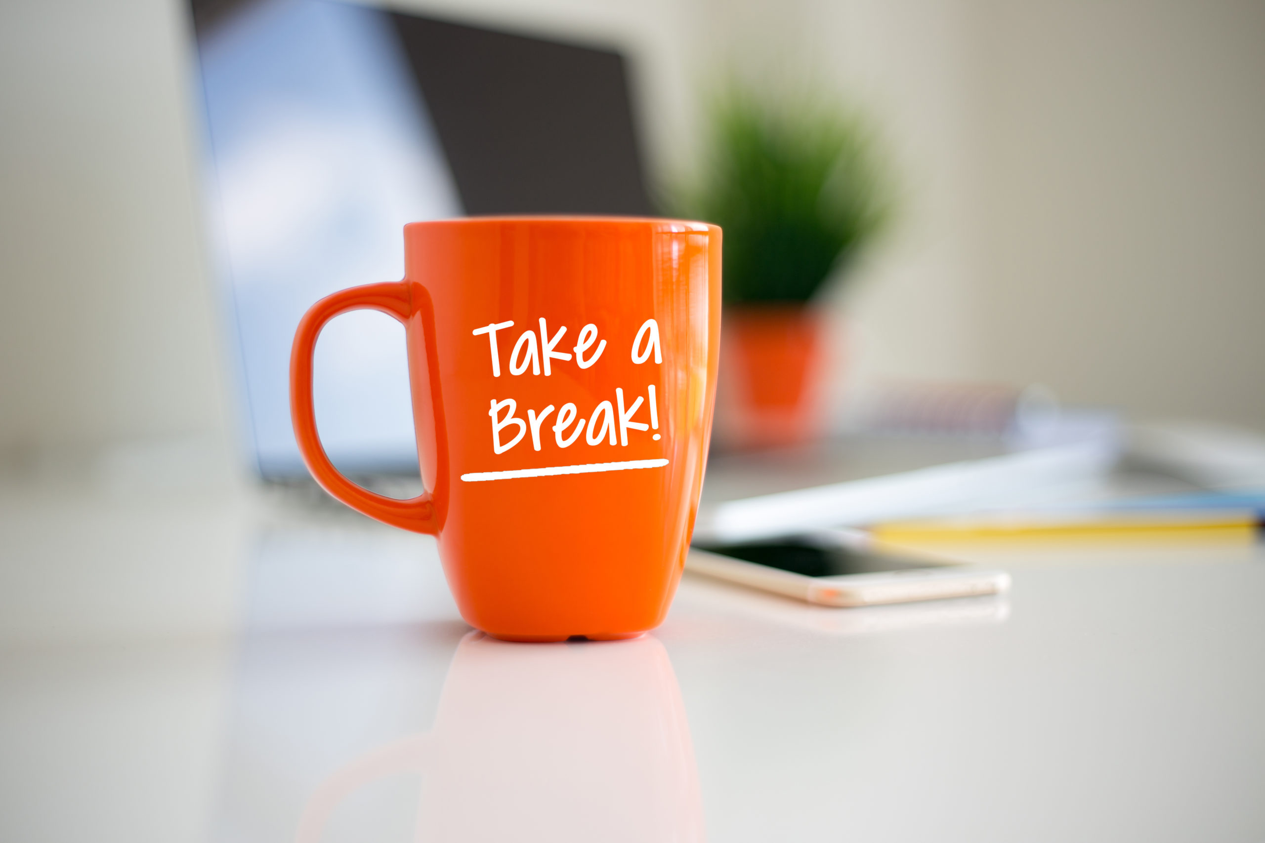 coffee cup with take a break printed on the cup